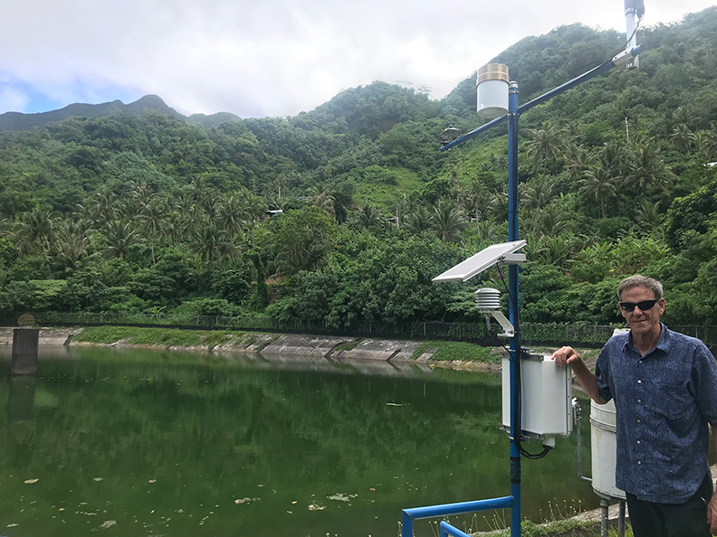 UH WRRC Director Tom Giambelluca visits one of the weather stations within the Tutuila Hydrologic Monitoring Network.